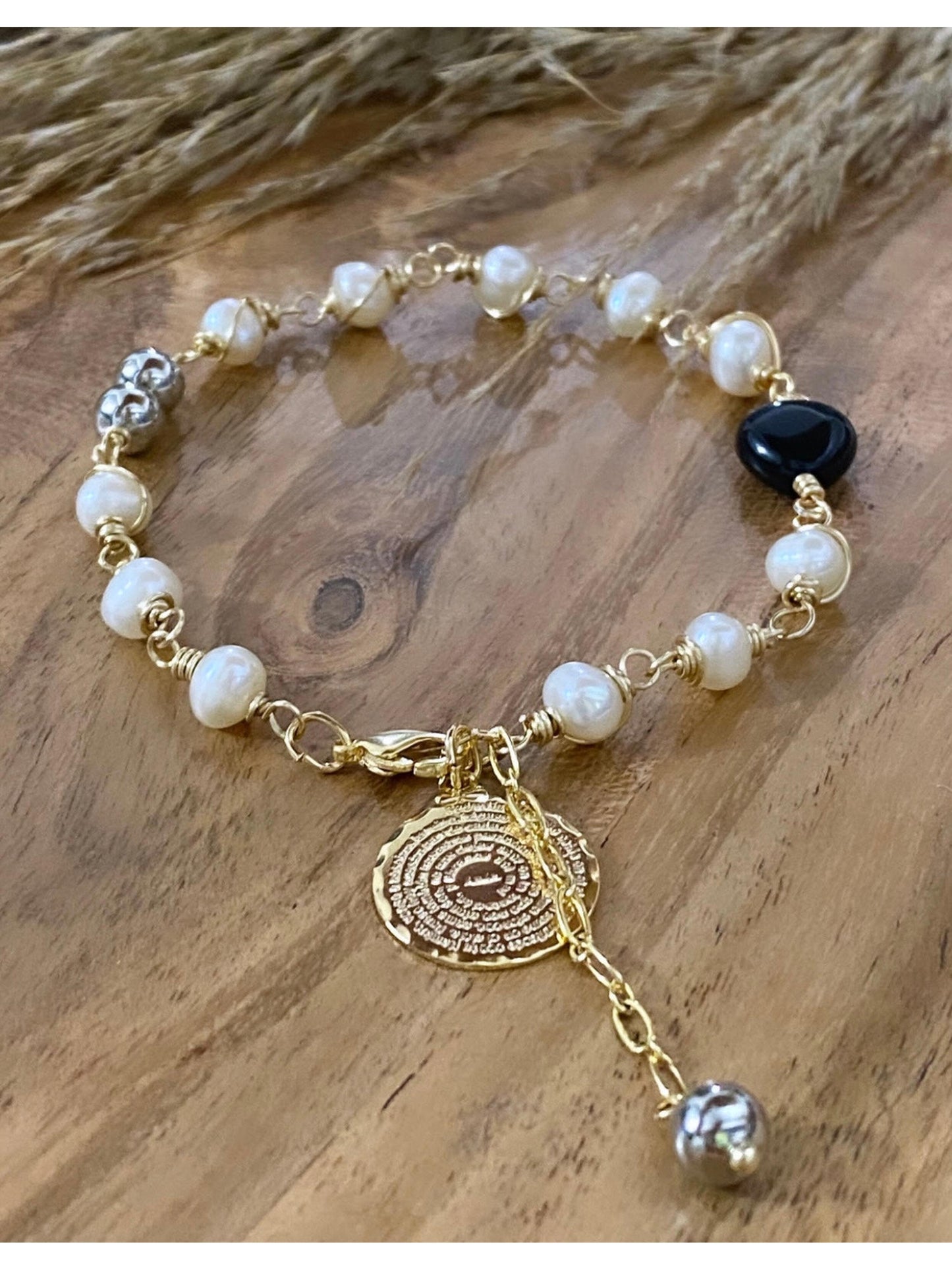 PADRENUESTRO (pulsera corazón negro )